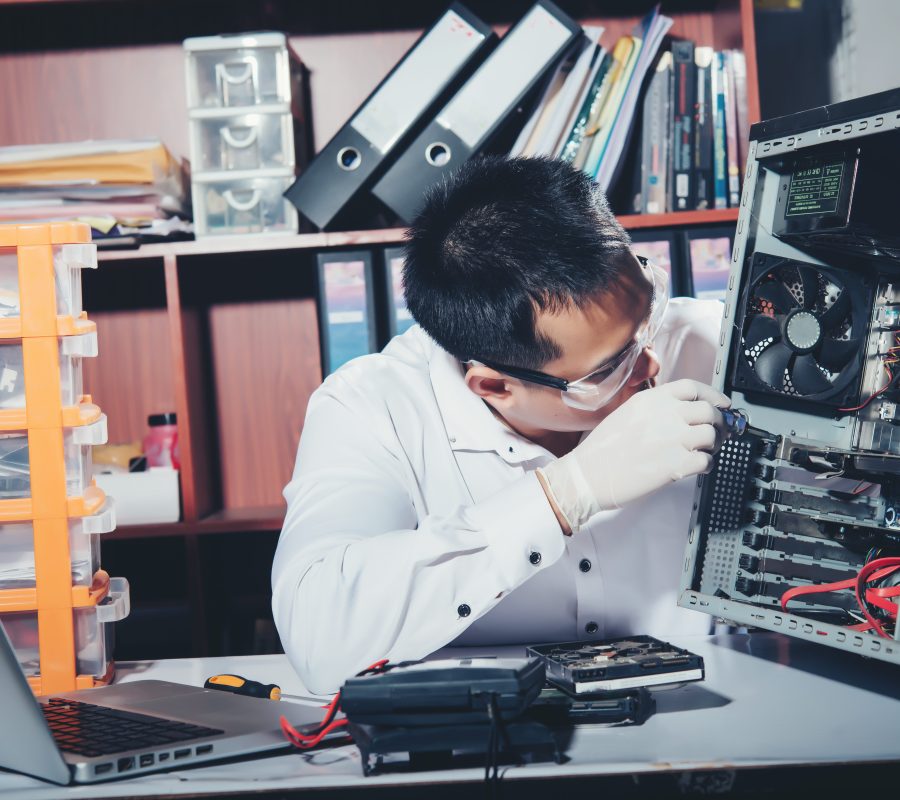 The technician repairing the computer,computer hardware, repairing, upgrade and technology